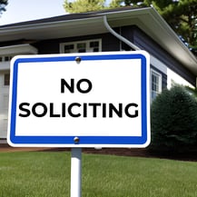 No Soliciting sign in front of a residential home.